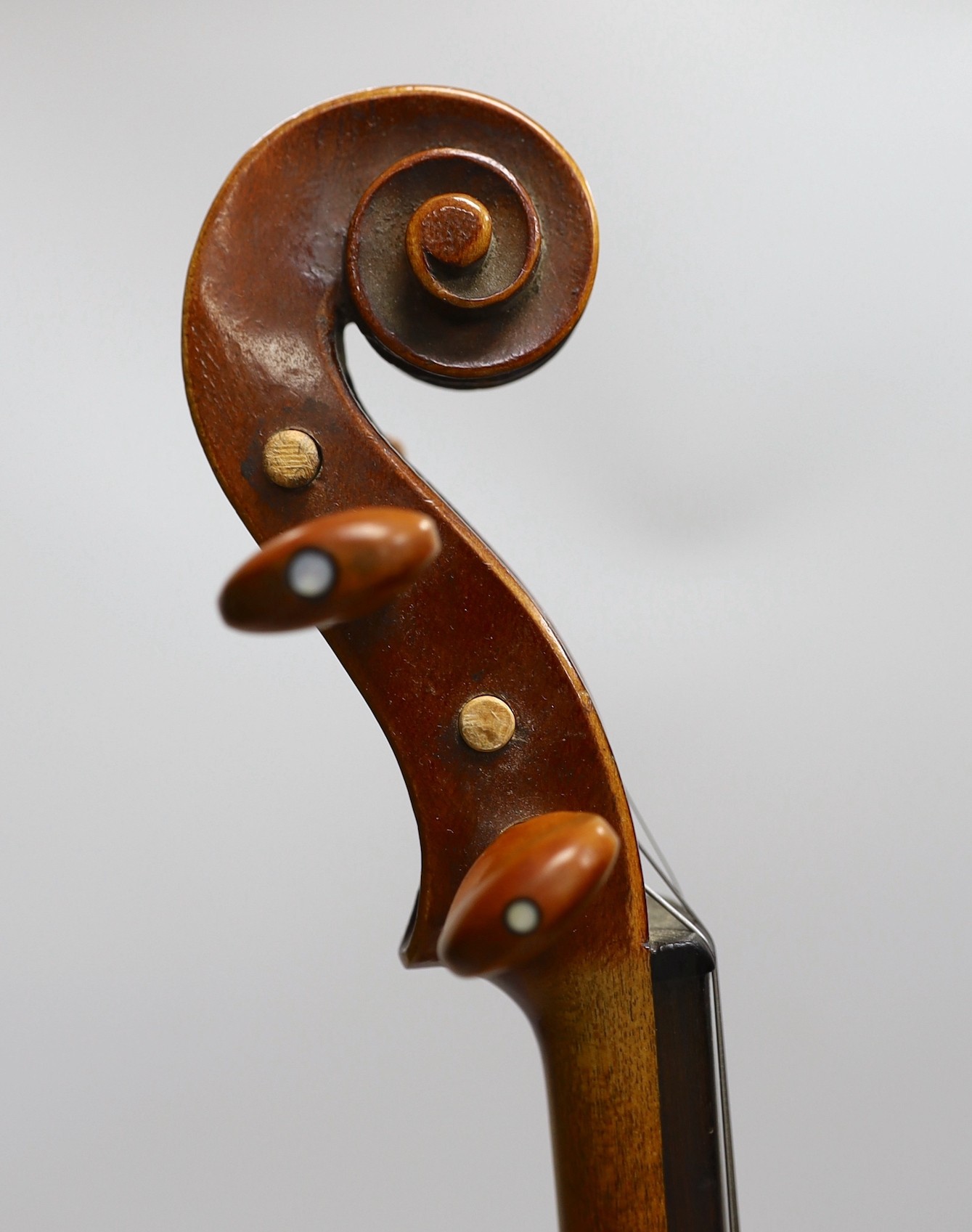 A French single back violin, interior label reads ‘Médio Fino’, back measures 35.5cm excl button. With case and bow